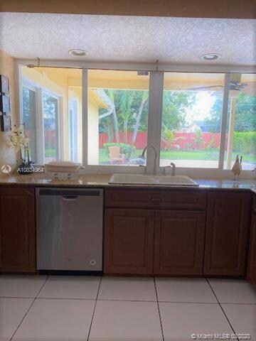 The kitchen has all stainless steel appliances and