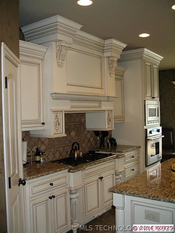 Massive custom furniture style cabinetry throughou