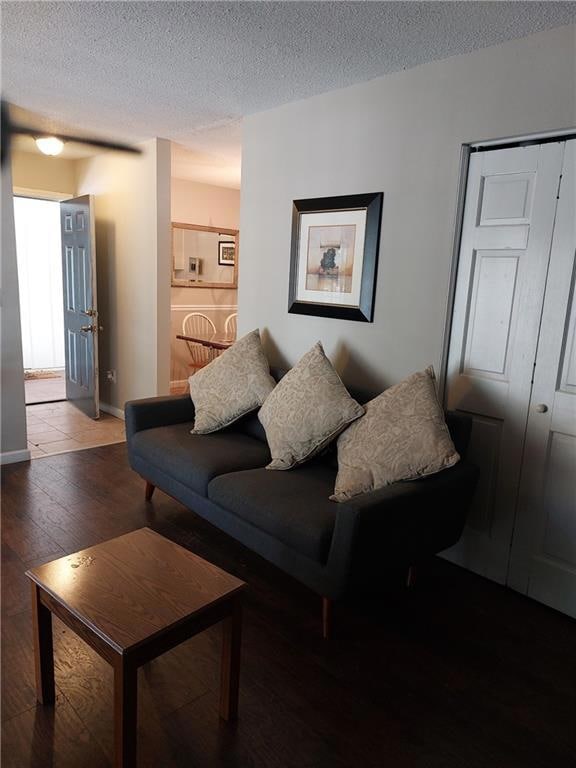 Living area with hardwood / wood-style flooring, a