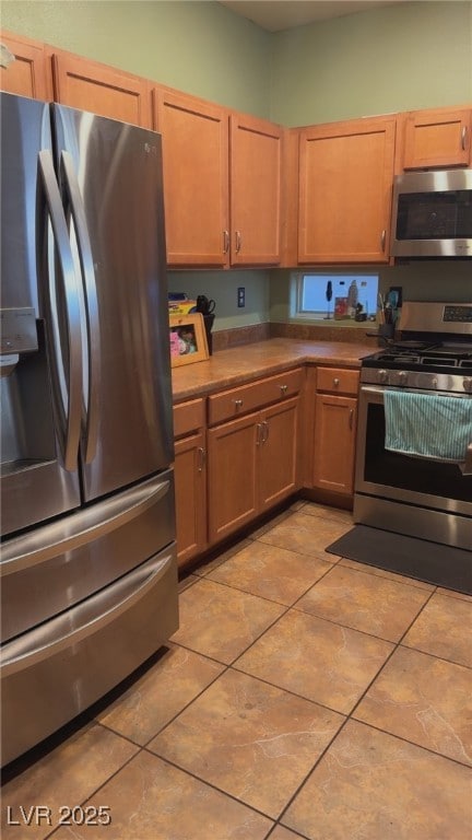Kitchen with appliances with stainless steel finis