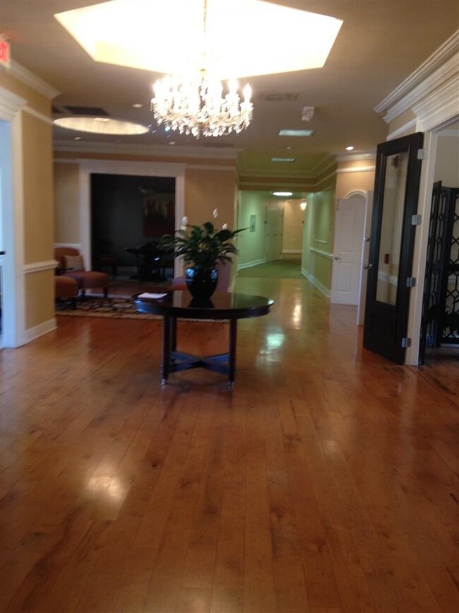Gorgeous hardwood and massive chandeliers in the g