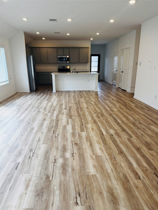 This spacious, open-concept kitchen and living are