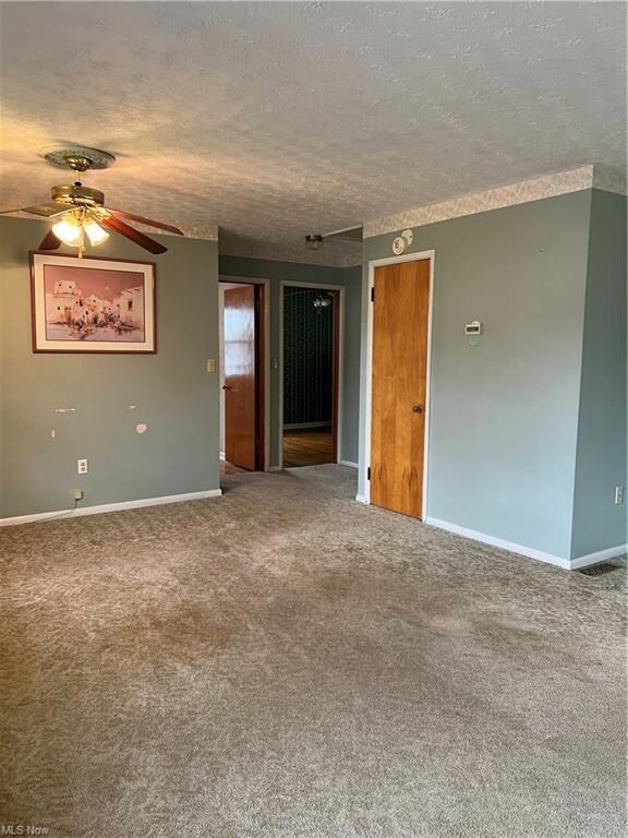 Living room 22 x 16 with carpeting and hardwood fl