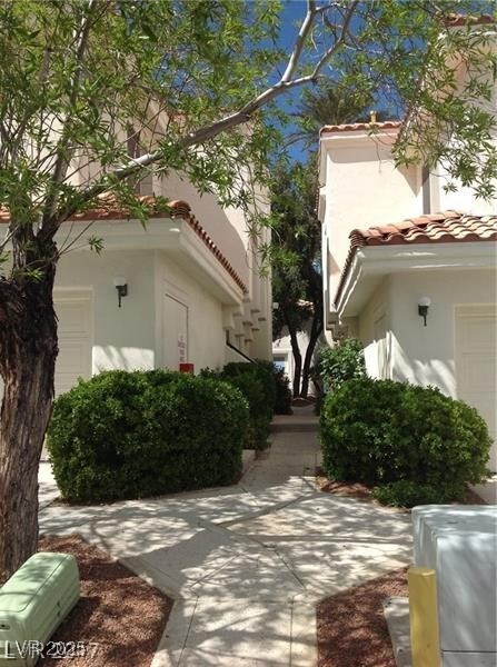 View of property's community with a garage
