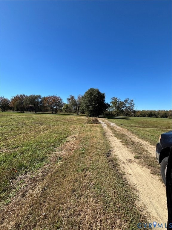 View of dirt / gravel road featuring a view of countryside