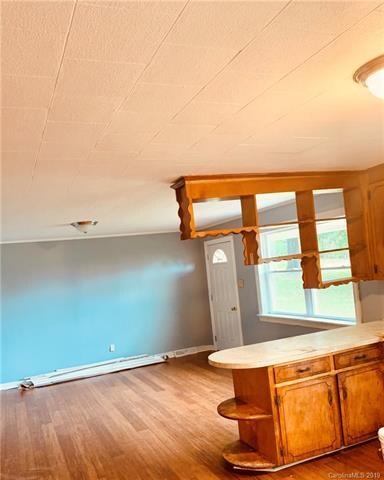 Renovations are in progress. Call listing agent for details. Large open kitchen with a charming country feel