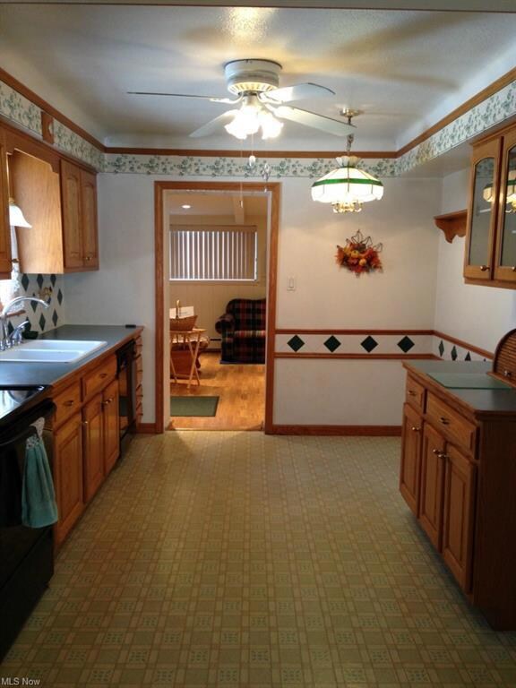 kitchen with eat-in area looking into family room