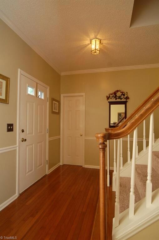 Welcoming foyer with hardwood floors