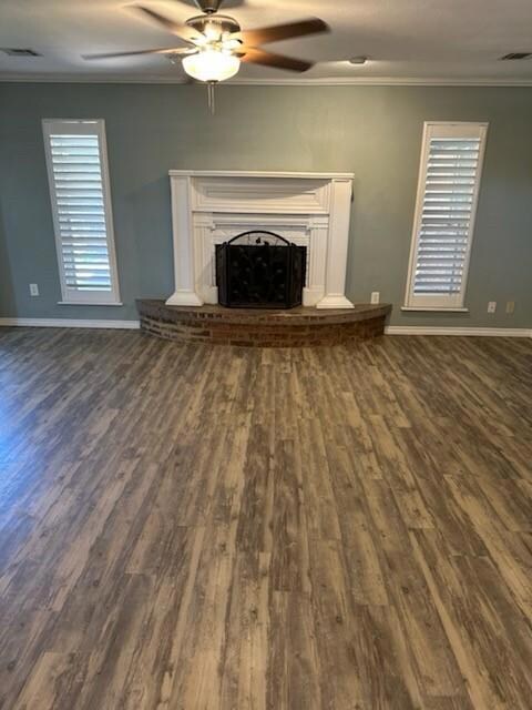Unfurnished living room featuring hardwood / wood-
