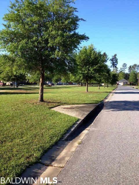 This lot is directly across from the expansive grassy common area. This view is looking to the south, from the road in front of lot.