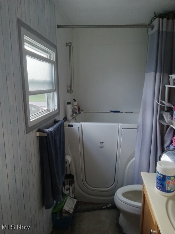 Bathroom with wooden walls and vanity