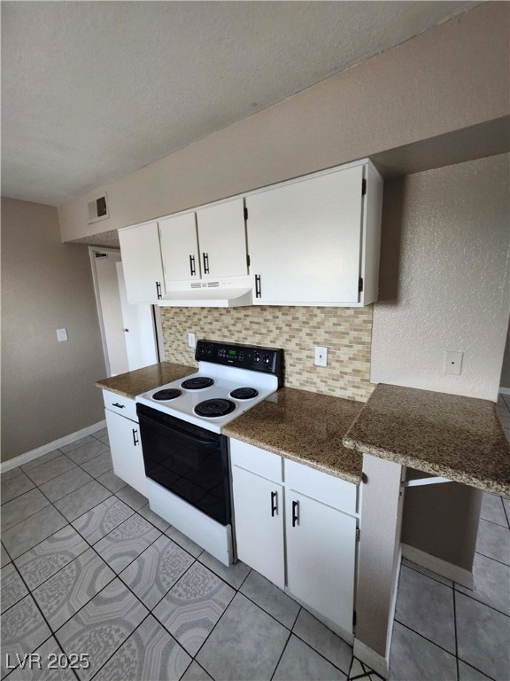 Kitchen with white range with electric stovetop, u