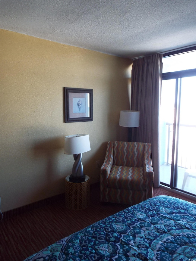 Bedroom with a textured ceiling
