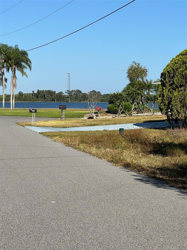 The lot sits 3 houses from beautiful LAKE GRASSY I