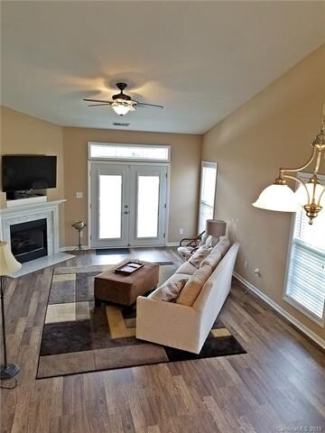 The living room area is bright, with neutral color