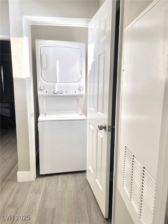 Laundry room featuring light wood-style floors, la