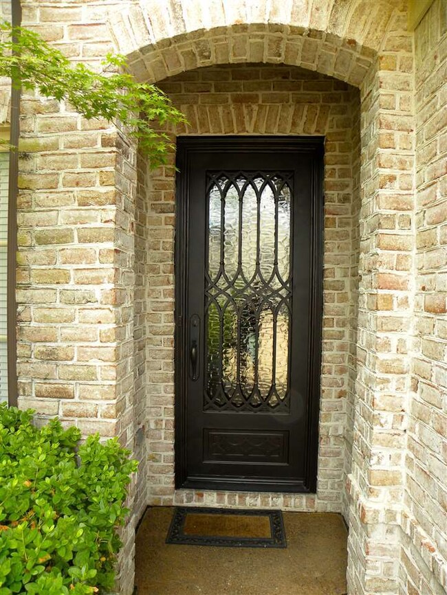 Stunning custom wrought iron front door from Tusca