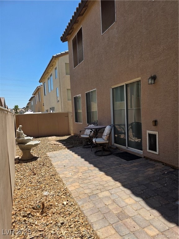 Fenced backyard with paver patio