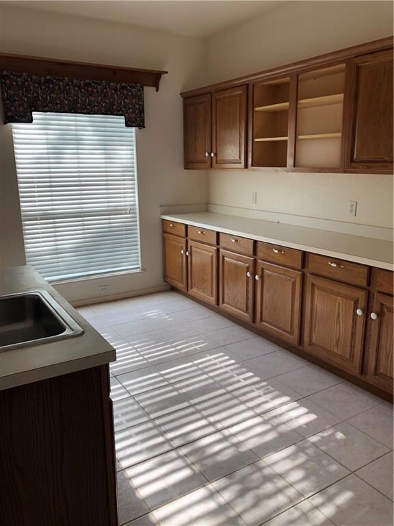 Oversized laundry work area with sink and tons of storage!