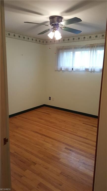 This 1st floor bedroom has a lighted ceiling fan, 