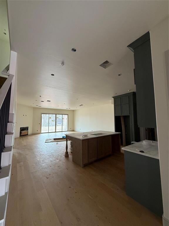 Kitchen featuring open floor plan and light wood-s