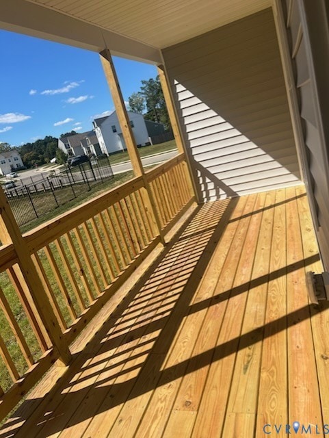 Wooden deck featuring a yard