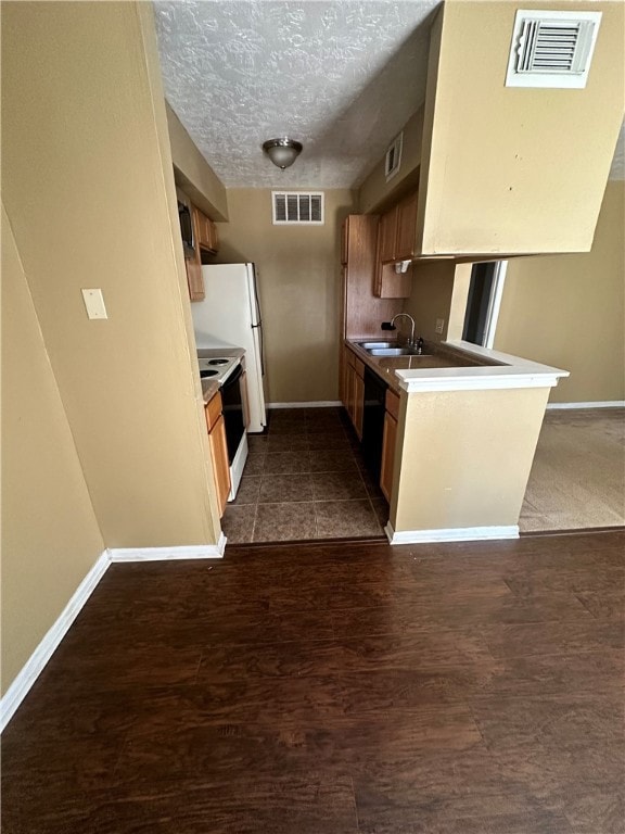 Kitchen featuring black dishwasher, visible vents,