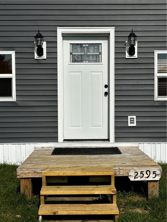 Front door of home w/front porch.