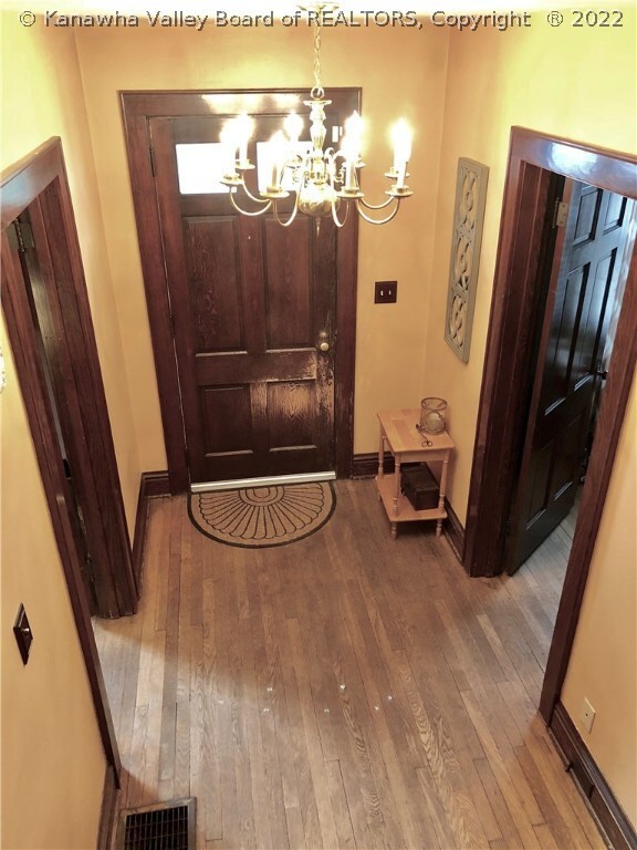 Formal Entryway. ORIGINAL Trim, Doors, & Floor!