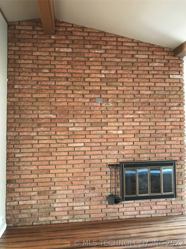 Distinctive, original floor to ceiling brick firep