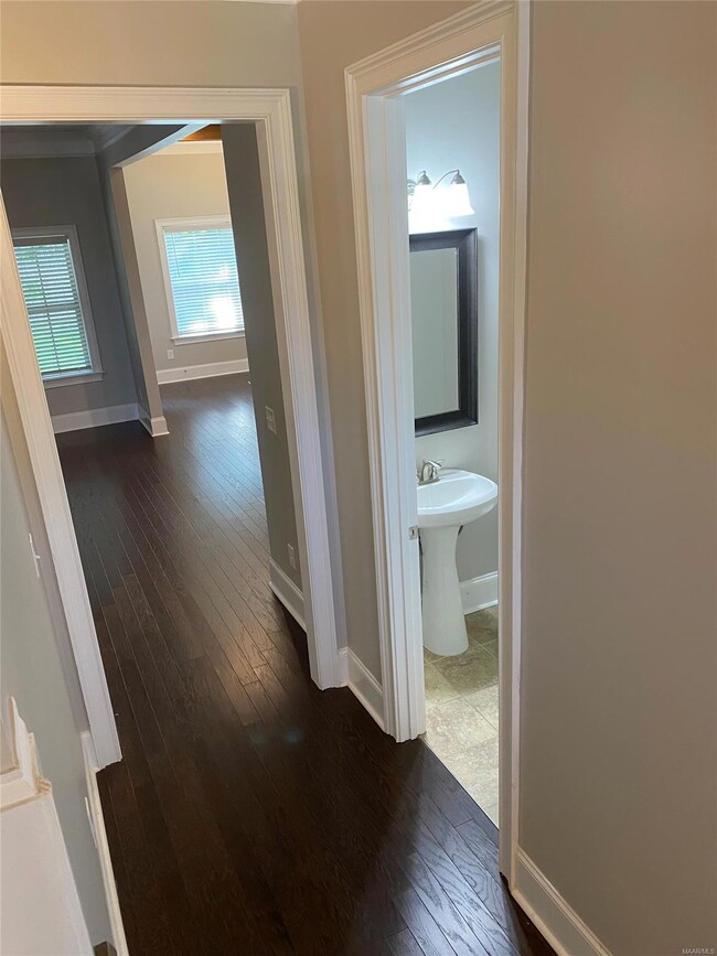 Heading to the great room is a half bathroom - gre
