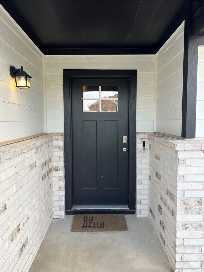 Property entrance with a porch