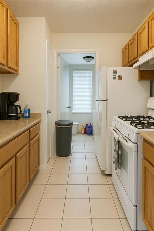 Kitchen featuring white range with gas cooktop, u