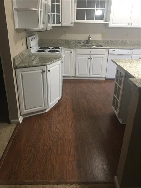 Updated kitchen Granite counter top with new floor