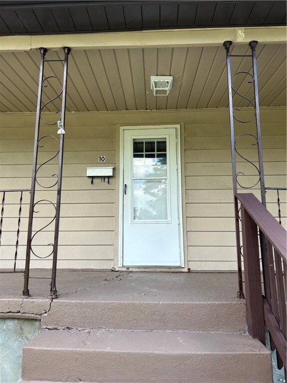 covered front porch, freshly painted