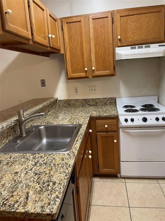 Kitchen featuring brown cabinets, under cabinet r