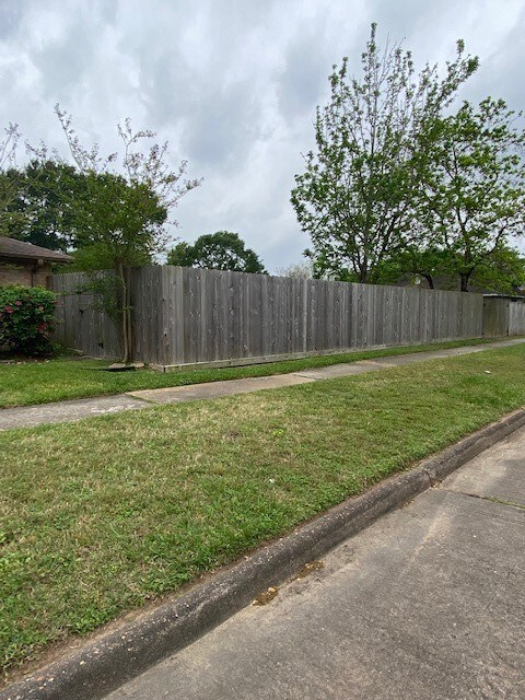 Lot is 9,000 square feet,  wood privacy fence is two years old