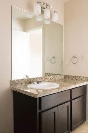 Bathroom featuring vanity and tile patterned flooring