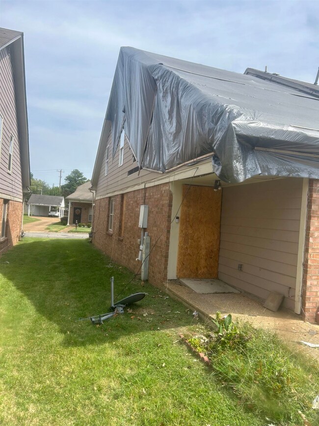 View of home's exterior with a lawn
