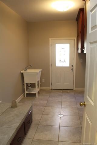 Huge laundry room with awesome cabinetry.  The per