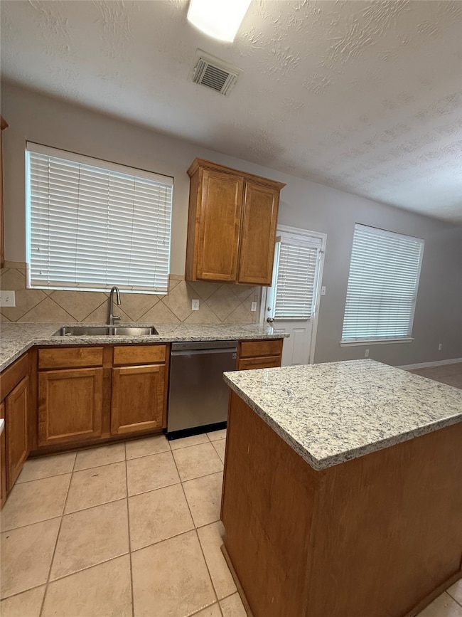 Another view of the kitchen, fridge included