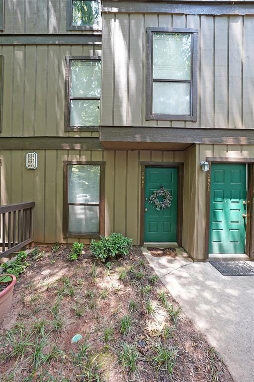 Entrance to property featuring board-and0batten siding