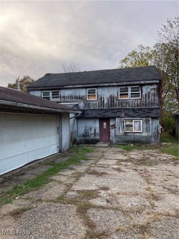 Traditional-style home featuring a garage