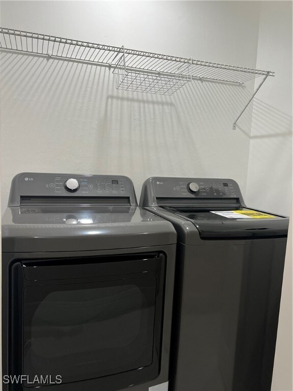 Laundry area featuring separate washer and dryer