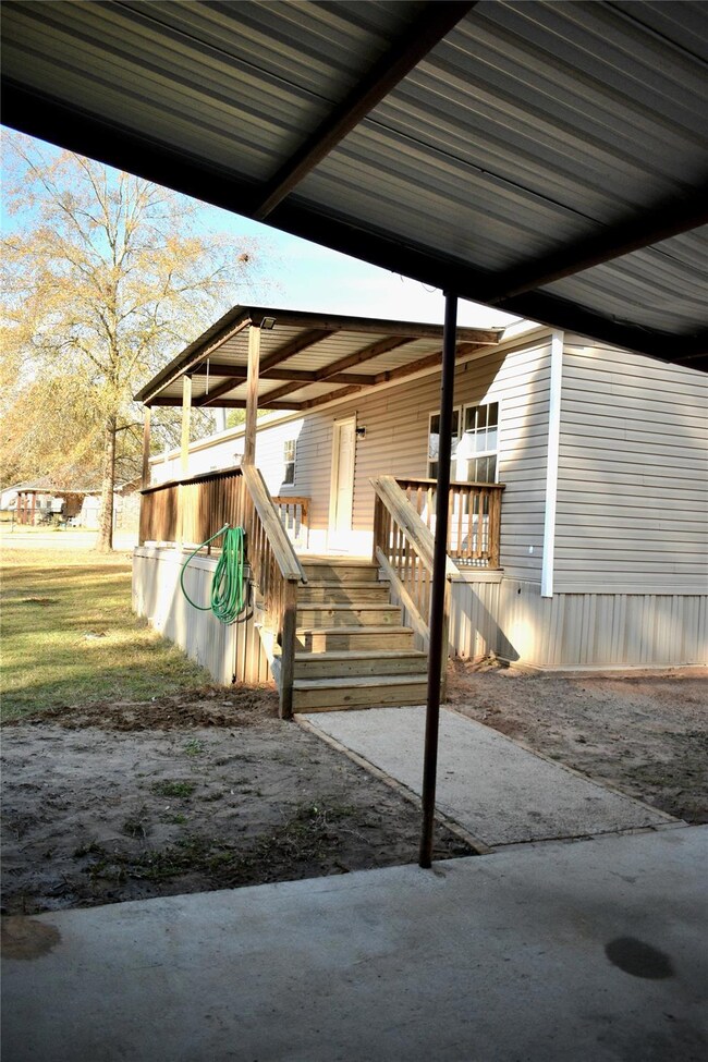 BACK PORCH FROM CARPORT.
