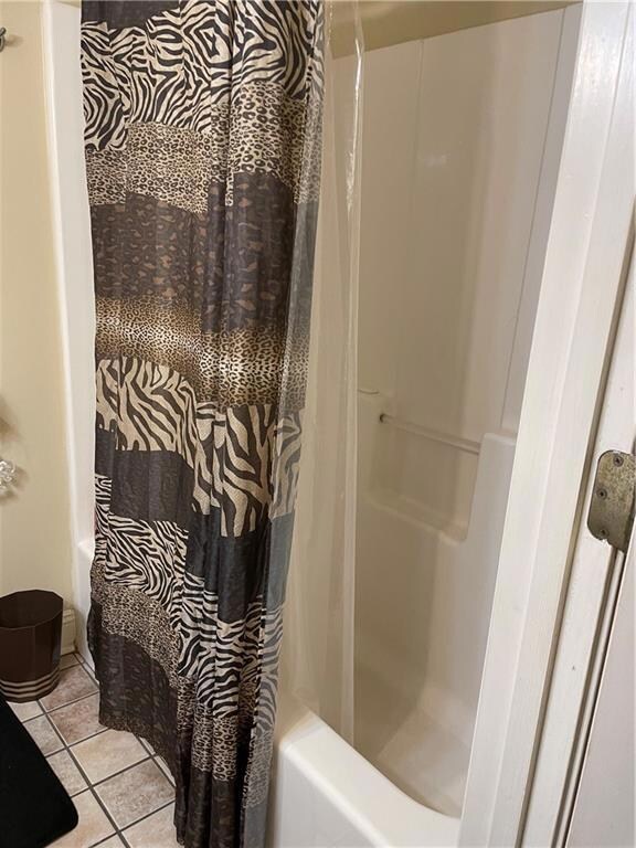 Bathroom has full tub/shower; tile floors...