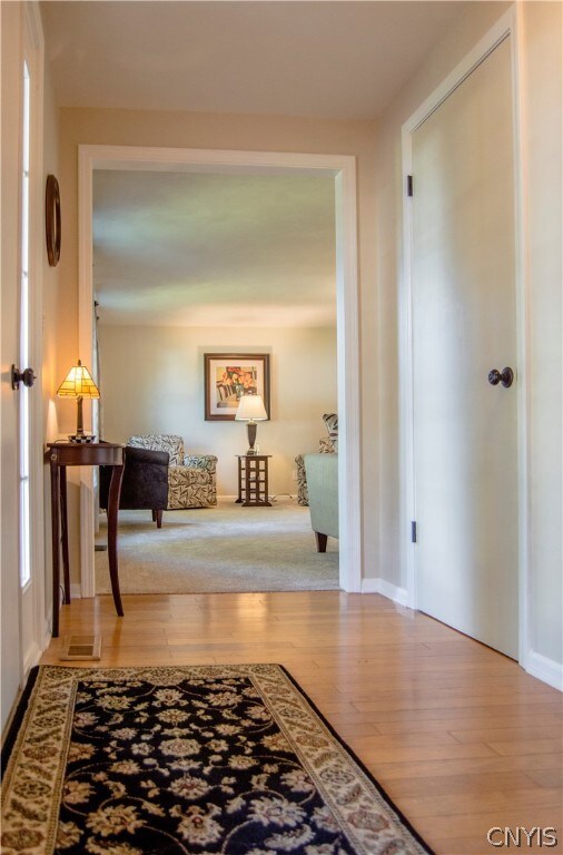Foyer with gleaming engineered hardwood floors
