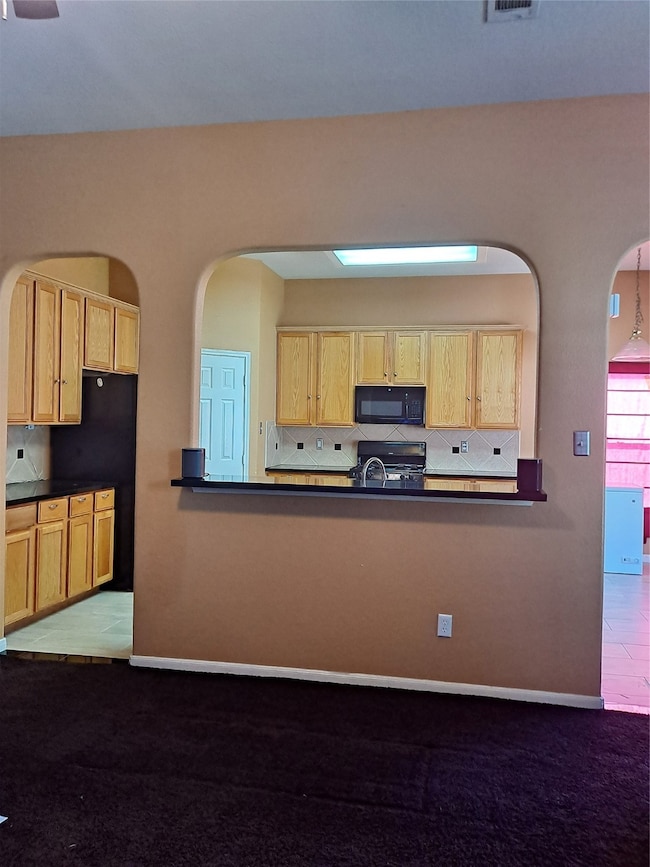 Family room looking into kitchen