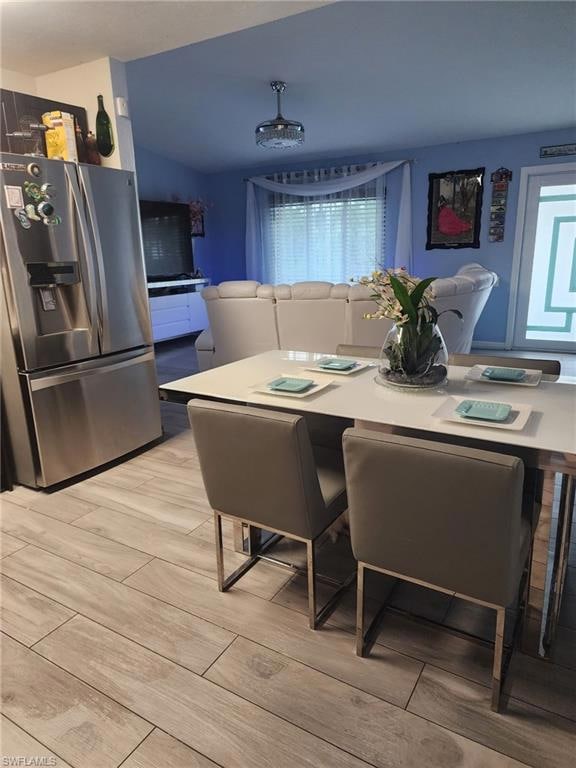 Dining space featuring wood tiled floors