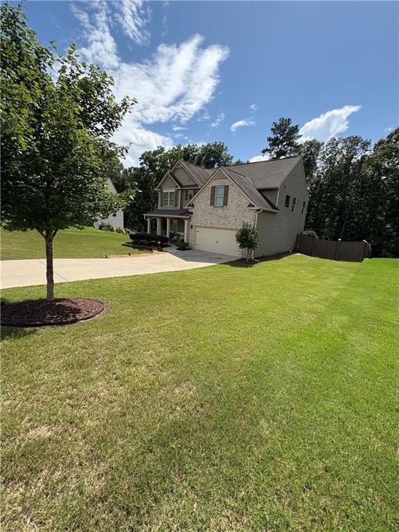 View of front of property with driveway, an attached garage, and brick siding